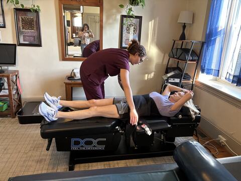 A patient being treated on a table at Kimberton Brain & Body