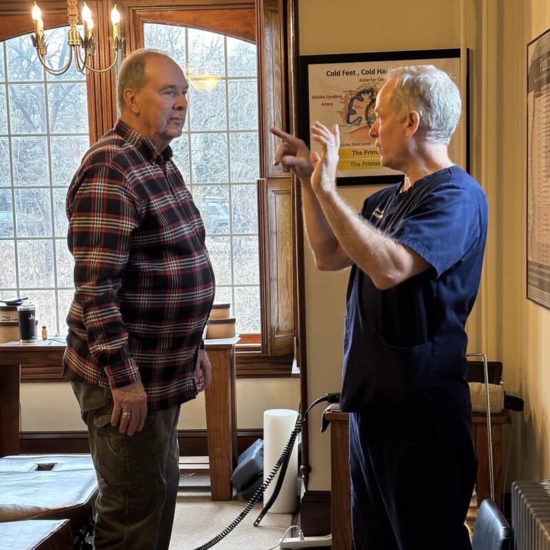 Dr. Schaffer carrying out a neurological exam with a patient