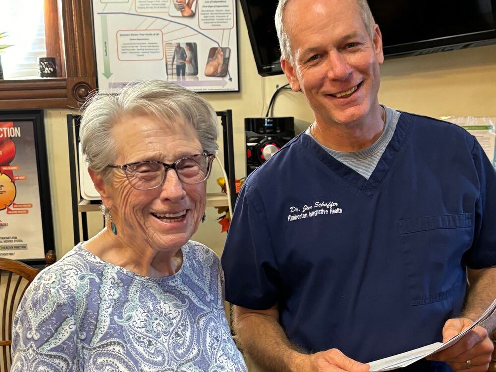 Dr. Jim Schaffer with a smiling patient at Kimberton Brain & Body in Phoenixville
